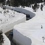 Highway in Japan with snow around more than 10 meters high.